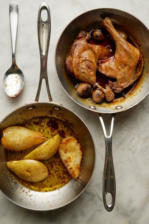 Image for article: Crispy-skinned duck legs with chestnuts, baked pear and potatoes boulangère