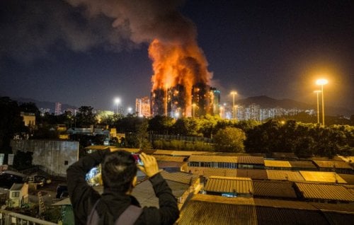 Image for article: Frantic hunt for survivors as Hong Kong towers burn