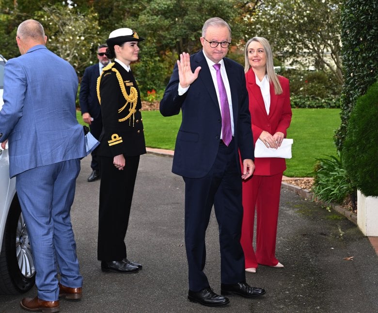 Anthony Albanese, with fiancée Jodie Haydon, arrives at Government House ahead of the swearing in of his new ministry.
