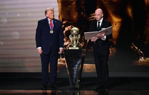 Donald Trump receiving the FIFA Peace Prize from FIFA president Gianni Infantino.