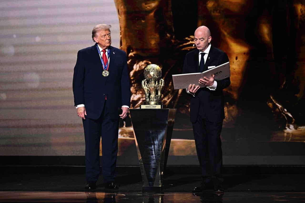 Donald Trump receiving the FIFA Peace Prize from FIFA president Gianni Infantino.