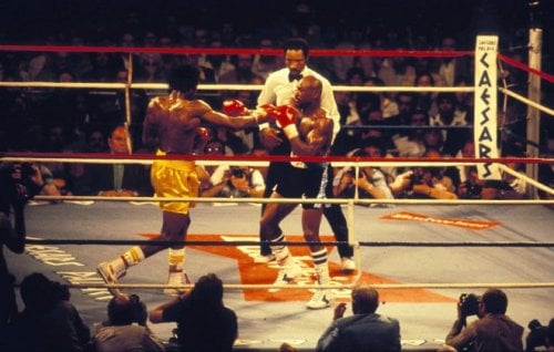 Tommy Hearns and Marvin Hagler fighting in the ring.