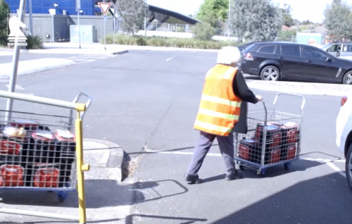 A Meals on Wheels worker delivers food.